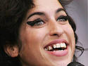 Amy Winehouse hospitalized after fainting in London home